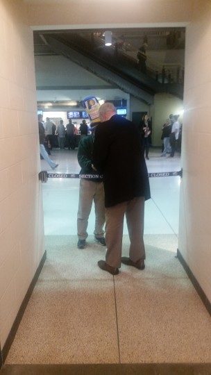 Slick Leonard signing an autograph during halftime of a Pacers game. He does a lot of this before during and after games. 